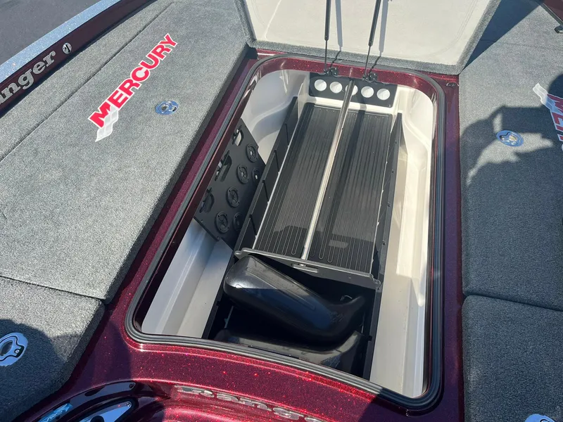 Slide: The Image of 2015 Ranger Z521 Comanche boat storage compartment with Mercury branding. - 16