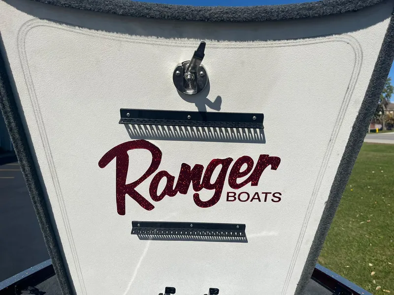 Slide: The Image of 2015 Ranger Z521 Comanche boat logo on white surface. - 17