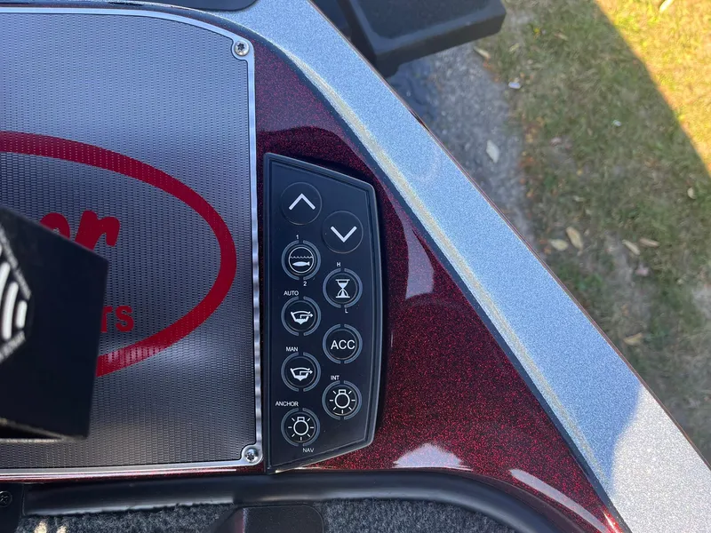 Slide: The Image of Control panel of a 2015 Ranger Z521 Comanche boat with various function buttons. - 20