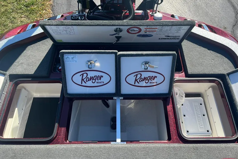 Slide: The Image of 2015 Ranger Z521 Comanche boat storage compartments open, showcasing ample space and organization. - 26