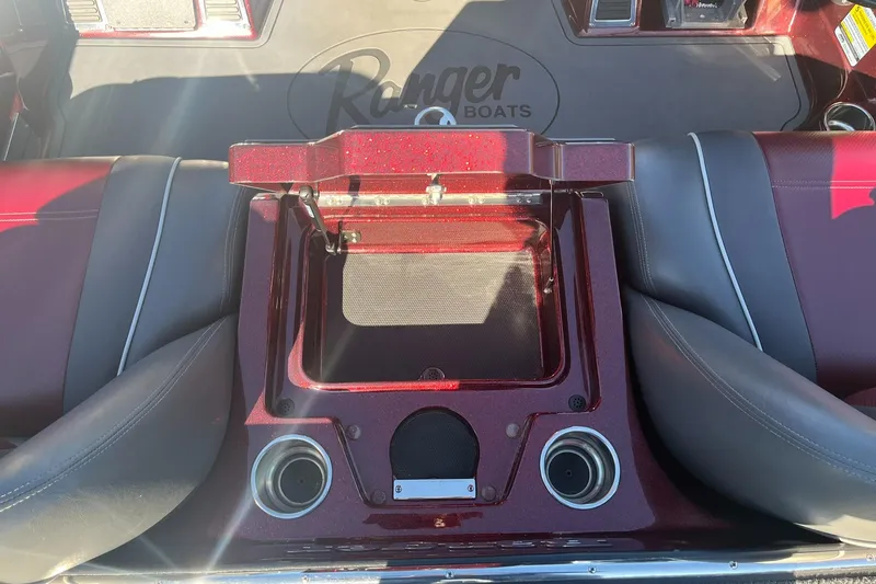 Slide: The Image of 2015 Ranger Z521 Comanche boat interior with storage compartment and cup holders. - 27