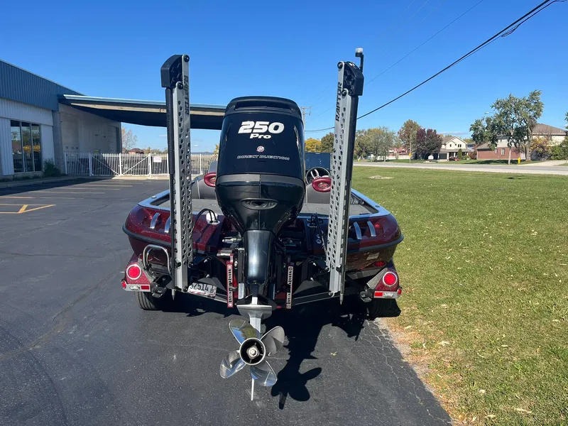 Slide: The Image of 2015 Ranger Z521 Comanche boat with 250 Pro motor, parked outdoors. - 3