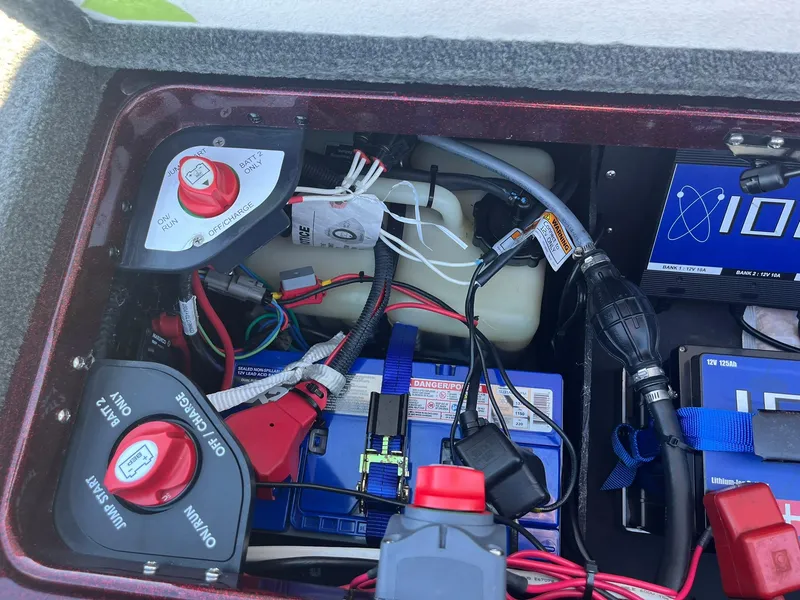 Slide: The Image of 2015 Ranger Z521 Comanche battery compartment with wiring and switches. - 30