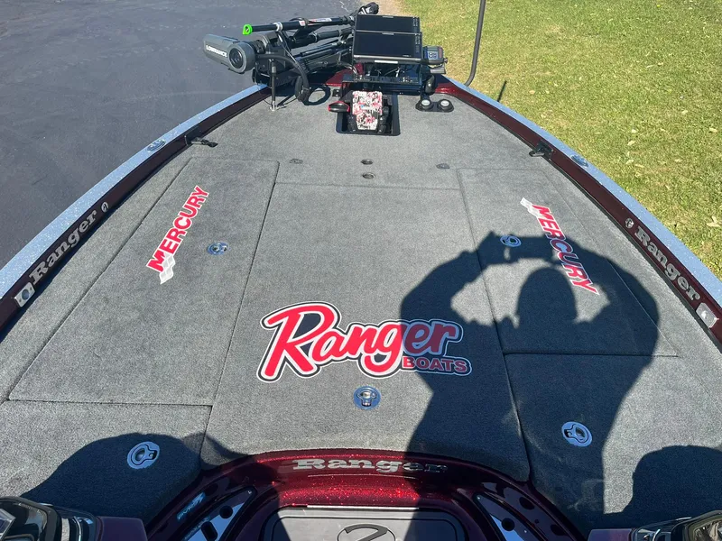 Slide: The Image of 2015 Ranger Z521 Comanche boat deck with Mercury branding and shadow. - 8