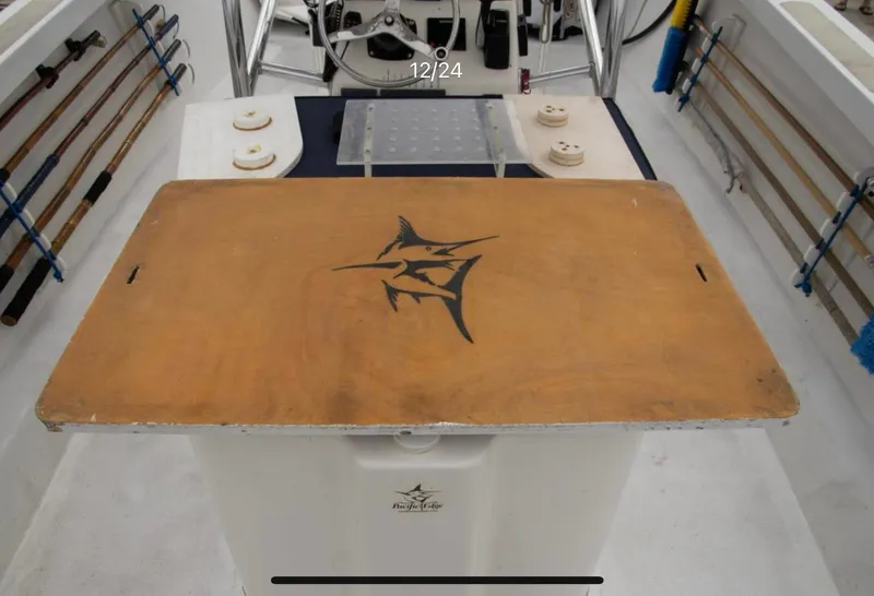 Slide: The Image of 1979 Chaparral 224 Fisherman boat interior with fishing rods and marlin logo. - 10
