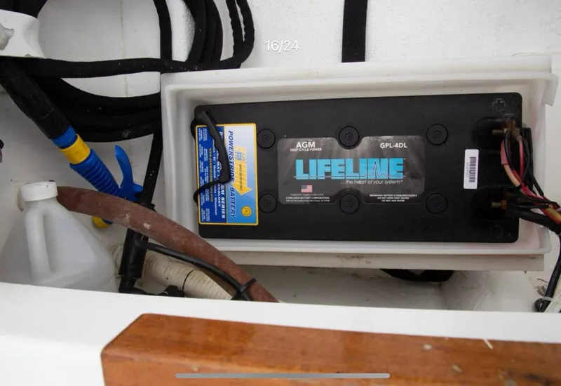 Slide: The Image of Lifeline battery in 1979 Chaparral 224 Fisherman boat compartment. - 14