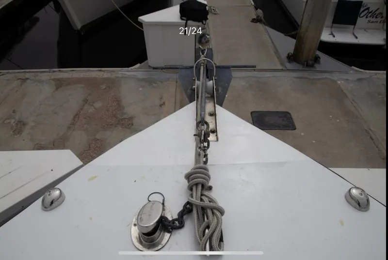 Slide: The Image of Bow of 1979 Chaparral 224 Fisherman boat docked with anchor and rope. - 15