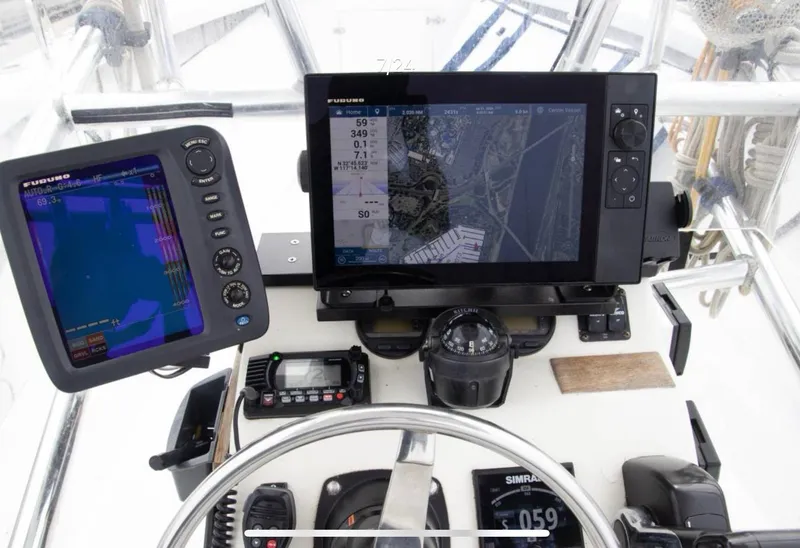 Slide: The Image of 1979 Chaparral 224 Fisherman boat dashboard with navigation and communication equipment. - 3
