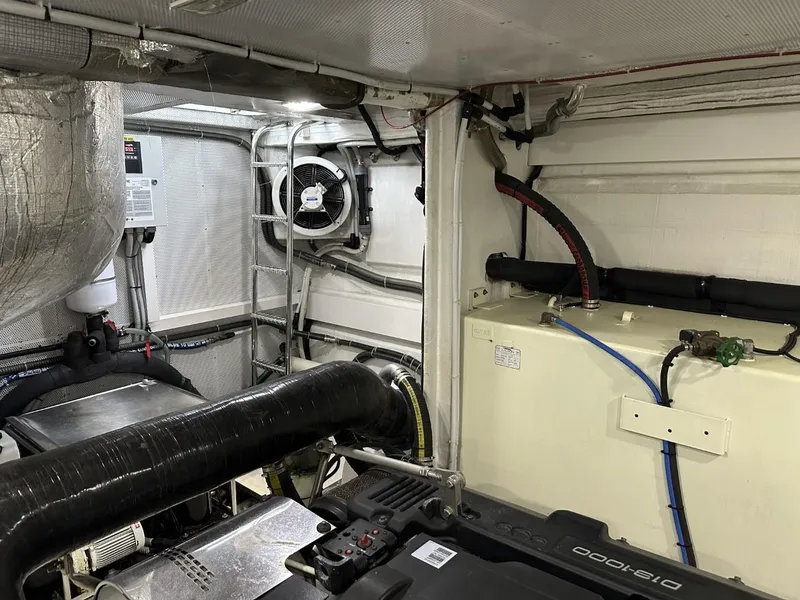 Slide: The Image of Engine room of 2019 Galeon 650 Sky yacht, featuring mechanical components and ventilation system. - 22