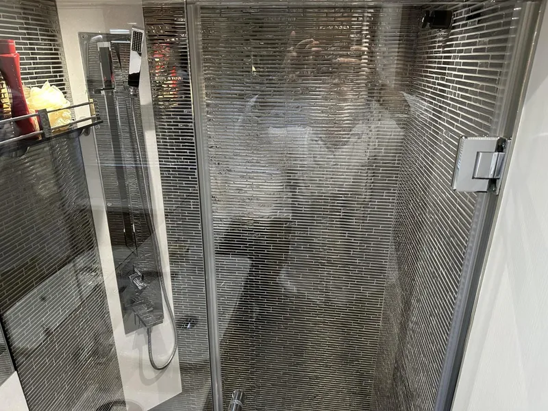 Slide: The Image of Luxurious shower area in 2019 Galeon 650 Sky yacht, featuring sleek modern design. - 23