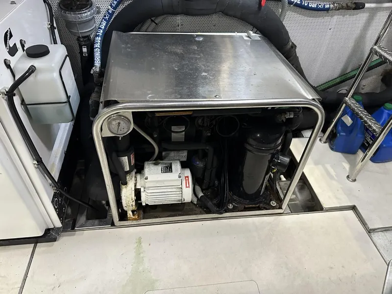 Slide: The Image of Engine compartment of 2019 Galeon 650 Sky yacht, showcasing mechanical components and equipment. - 30