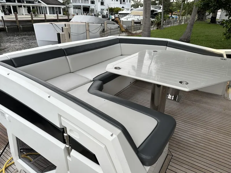 Slide: The Image of Spacious seating area on 2019 Galeon 650 Sky yacht with sleek table and modern design. - 34