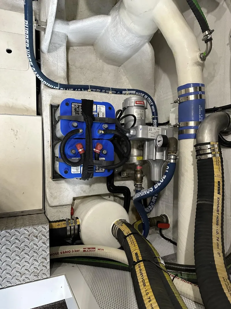 Slide: The Image of Engine compartment of 2019 Galeon 650 Sky yacht with hoses and components. - 39