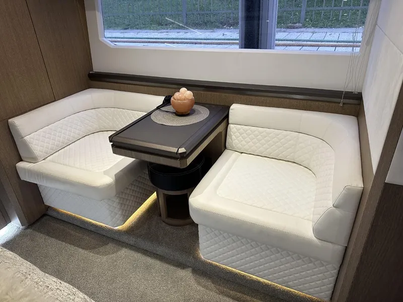 Slide: The Image of Luxurious interior of 2019 Galeon 650 Sky yacht with elegant seating and table. - 44
