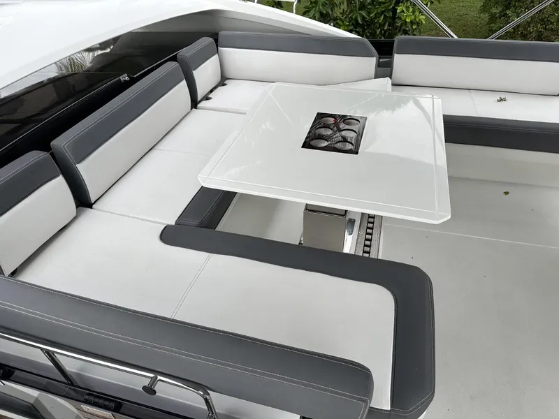 Slide: The Image of Luxurious seating area on 2019 Galeon 650 Sky yacht with sleek white and gray design. - 47