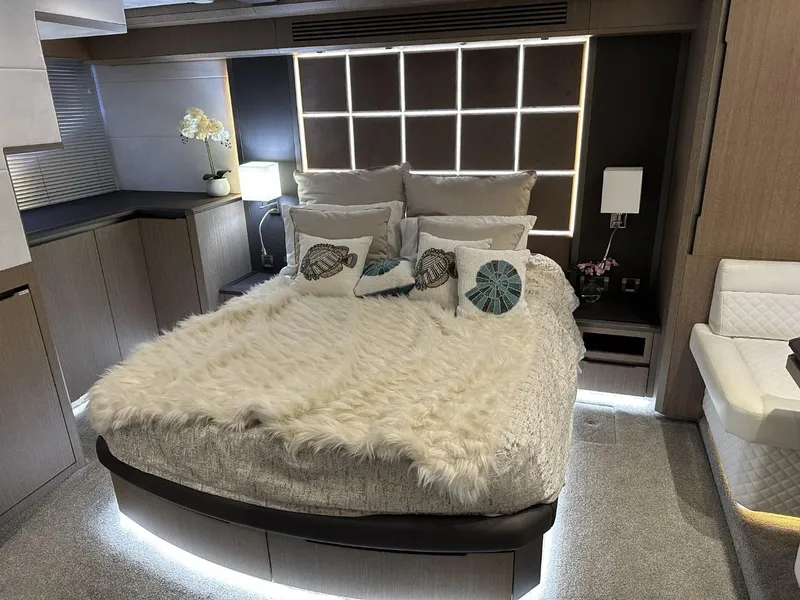 Slide: The Image of Luxurious bedroom interior of 2019 Galeon 650 Sky yacht with modern decor and ambient lighting. - 48