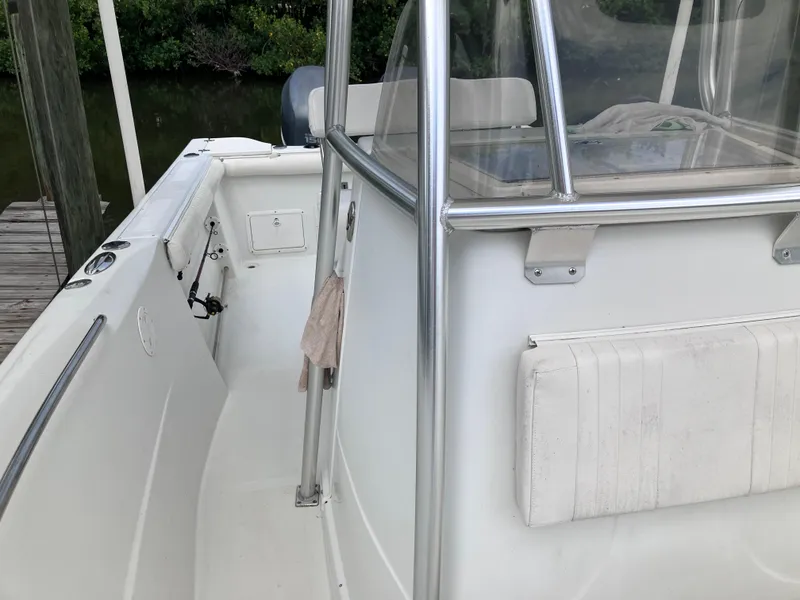 Slide: The Image of 2005 Sailfish 266 CC boat interior with seating and railing. - 14