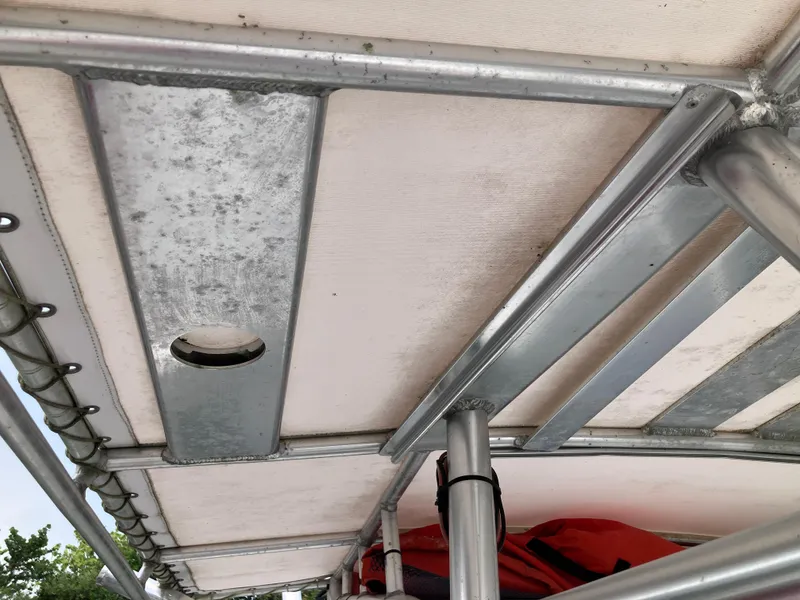 Slide: The Image of Close-up of 2005 Sailfish 266 CC boat's metal framework and canopy. - 18