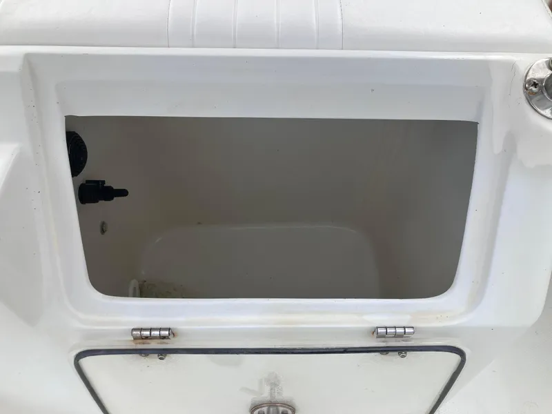 Slide: The Image of Open storage compartment on 2005 Sailfish 266 CC boat. - 22