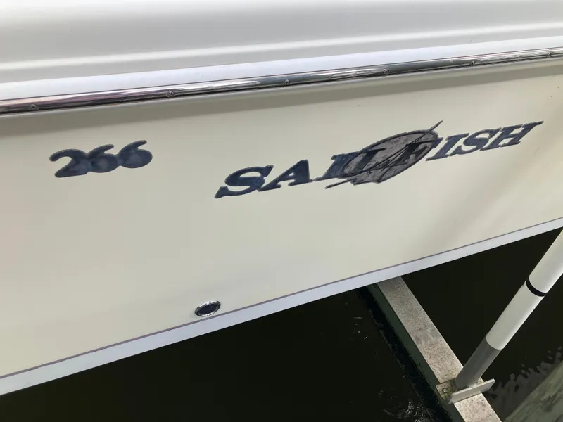 Slide: The Image of 2005 Sailfish 266 CC boat side view with logo and model number. - 9