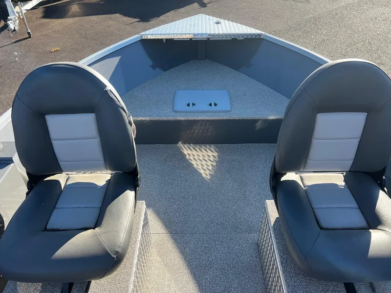 Slide: The Image of 2024 Fish Rite Angler 18 boat interior with two cushioned seats. - 11