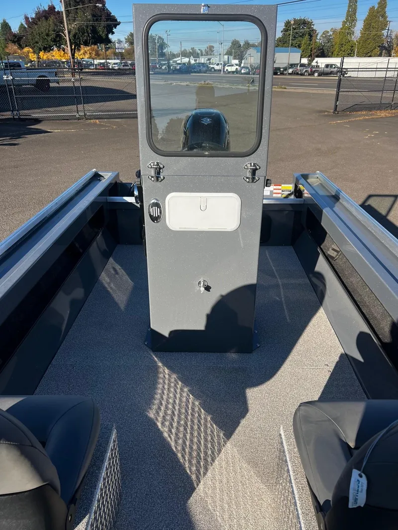 Slide: The Image of 2024 Fish Rite Angler 18 boat interior with central console and seating. - 12