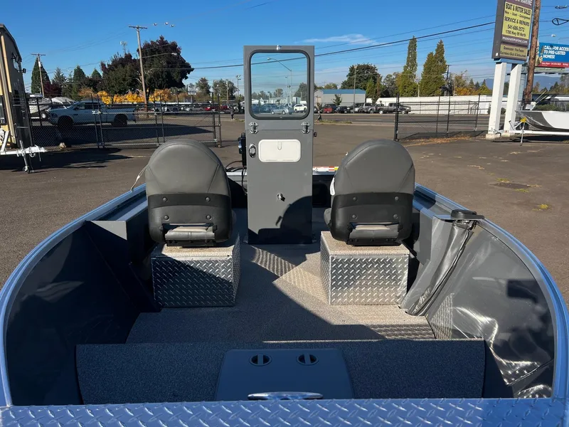 Slide: The Image of 2024 Fish Rite Angler 18 boat interior with two seats and a central console. - 13