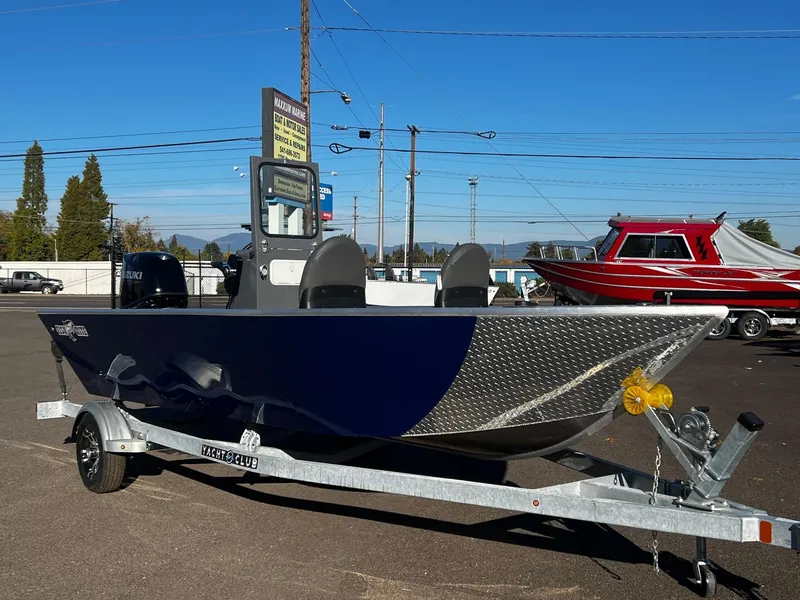Slide: The Image of 2024 Fish Rite Angler 18 boat on trailer in outdoor lot. - 2