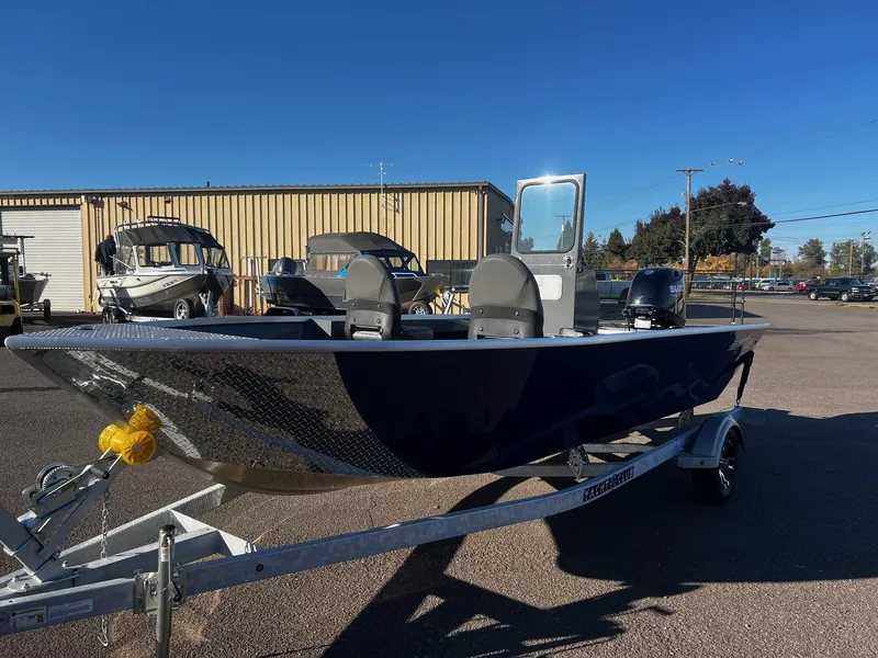 Slide: The Image of 2024 Fish Rite Angler 18 boat on trailer in sunny outdoor setting. - 3