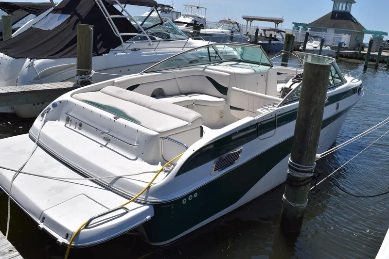 The Image of 2001 Crownline 288 BR boat docked at marina, featuring spacious seating and sleek design. - 0