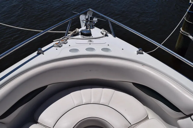 Slide: The Image of Bow view of 2001 Crownline 288 BR boat with white seating and railing. - 15