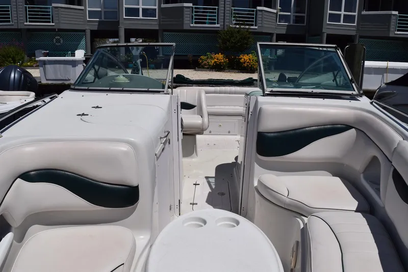 Slide: The Image of 2001 Crownline 288 BR boat interior with white seating and open deck. - 6