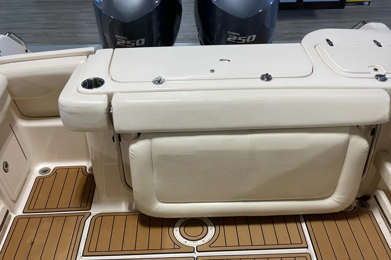 Slide: The Image of 2016 Grady-White 275 Freedom boat interior with Yamaha 250 engines and teak flooring. - 10