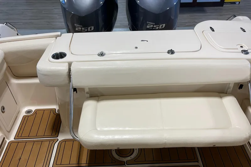 Slide: The Image of 2016 Grady-White 275 Freedom boat interior with seating and twin 250 engines. - 11