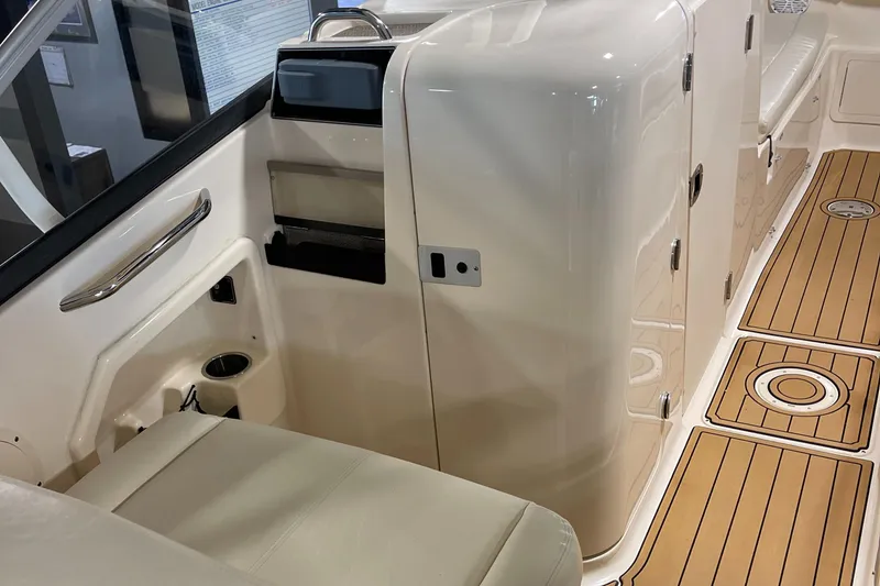Slide: The Image of Interior of 2016 Grady-White 275 Freedom boat with seating and storage compartments. - 12