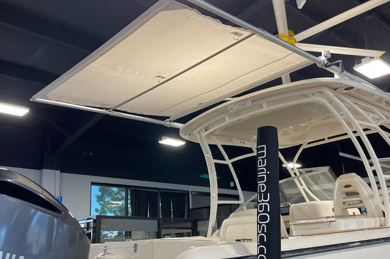 Slide: The Image of 2016 Grady-White 275 Freedom boat with canopy in showroom. - 18