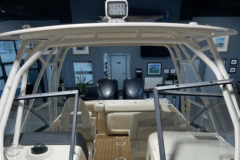 Slide: The Image of 2016 Grady-White 275 Freedom boat interior with dual engines and seating. - 19