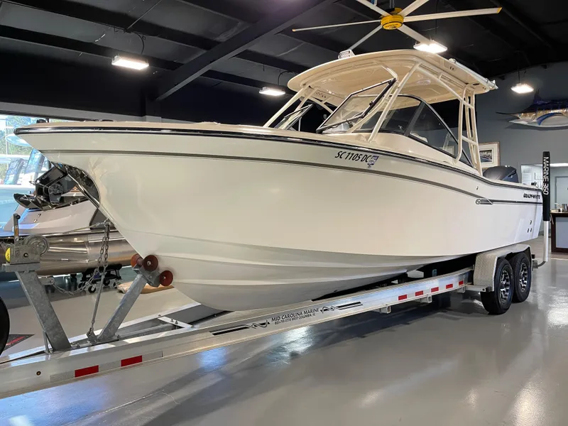 Slide: The Image of 2016 Grady-White 275 Freedom boat on trailer in showroom. - 2