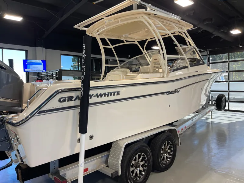 Slide: The Image of 2016 Grady-White 275 Freedom boat on trailer in showroom. - 6