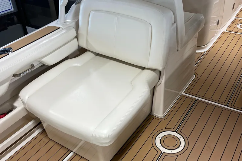 Slide: The Image of Grady-White 275 Freedom 2016 boat seat with teak-style flooring. - 8