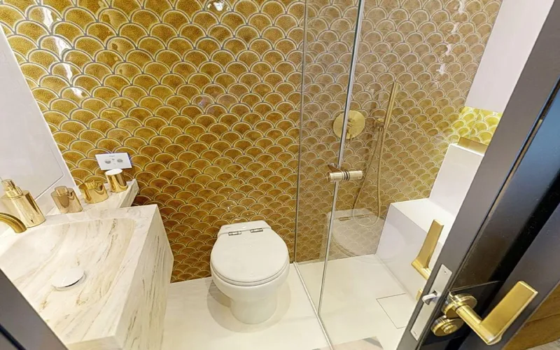 Slide: The Image of Luxurious bathroom with gold accents in 2024 Sunreef 60 Sail yacht. - 10