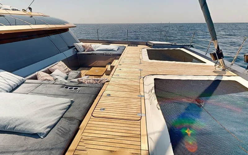 Slide: The Image of Luxurious 2024 Sunreef 60 Sail yacht deck with comfortable seating and ocean view. - 16