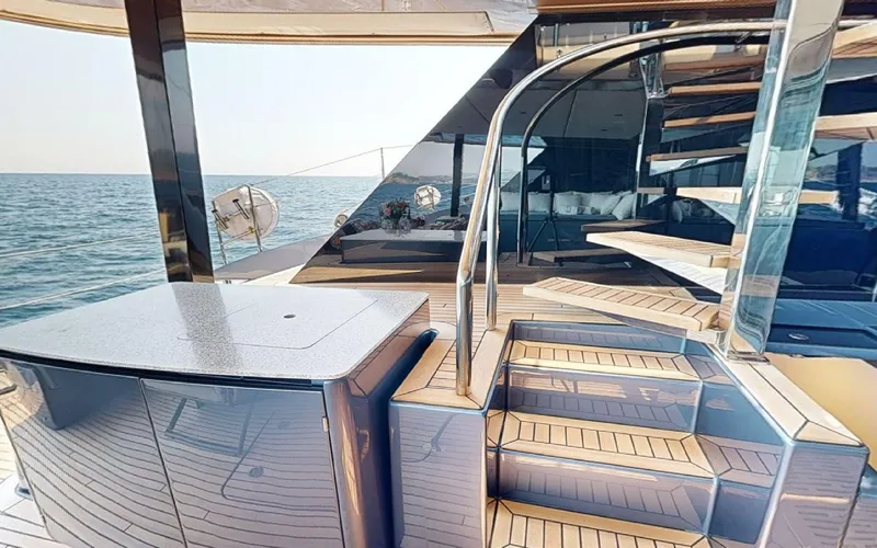 Slide: The Image of Luxurious Sunreef 60 Sail yacht deck with elegant spiral staircase, 2024 model. - 21