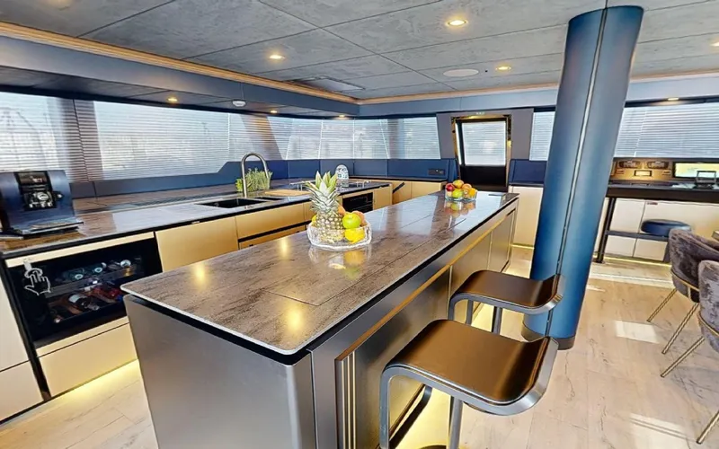 Slide: The Image of Luxurious interior of 2024 Sunreef 60 Sail yacht with modern kitchen and seating area. - 5
