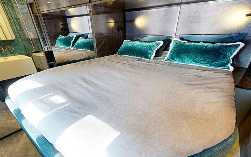 Slide: The Image of Luxurious bedroom interior of 2024 Sunreef 60 Sail yacht with plush bedding. - 8