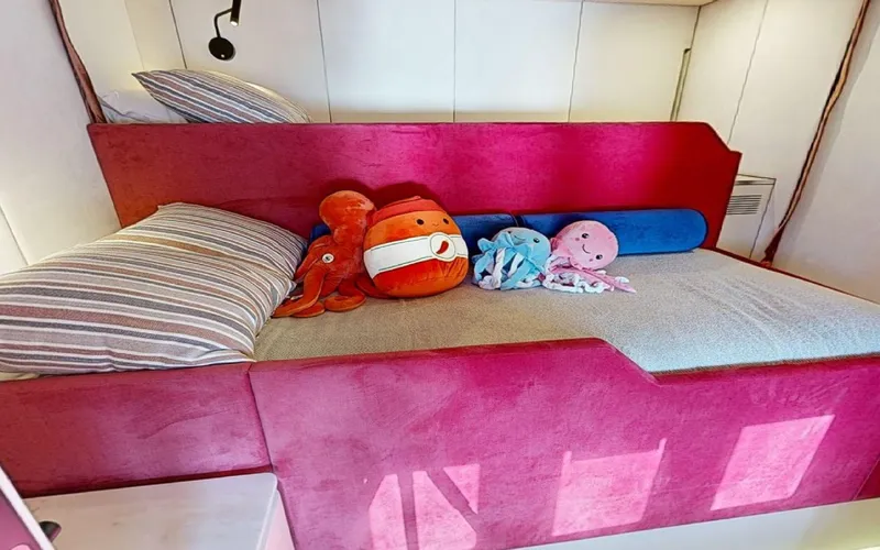 Slide: The Image of Cozy cabin bed with plush toys on 2024 Sunreef 60 Sail yacht. - 9
