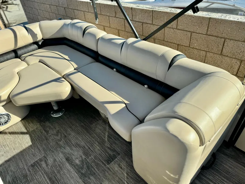 Slide: The Image of 2022 Tahoe Pontoon Cascade Platinum Rear J Lounger with beige seating and modern design. - 17