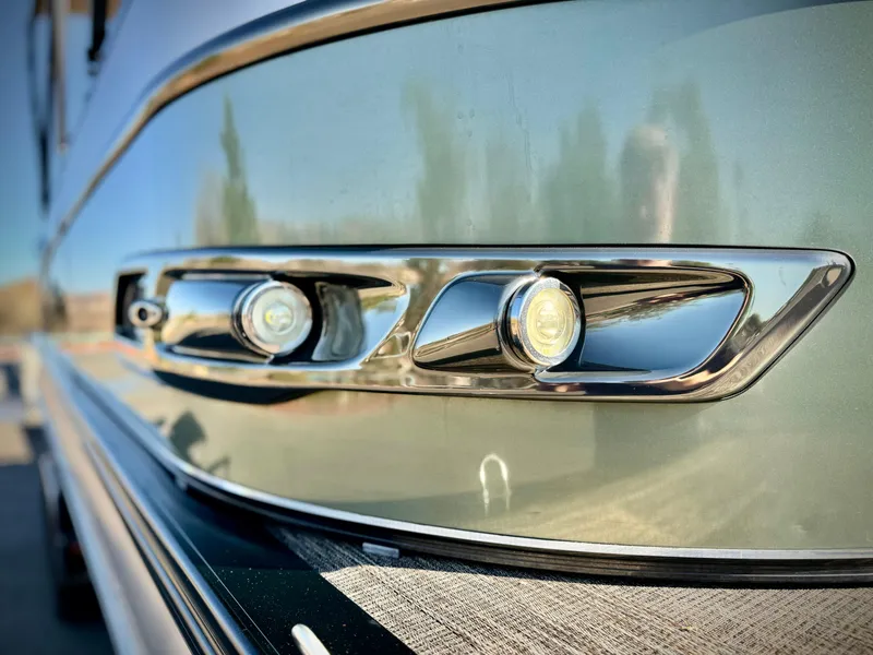 Slide: The Image of 2022 Tahoe Pontoon Cascade Platinum Rear J Lounger, close-up of sleek exterior design. - 9