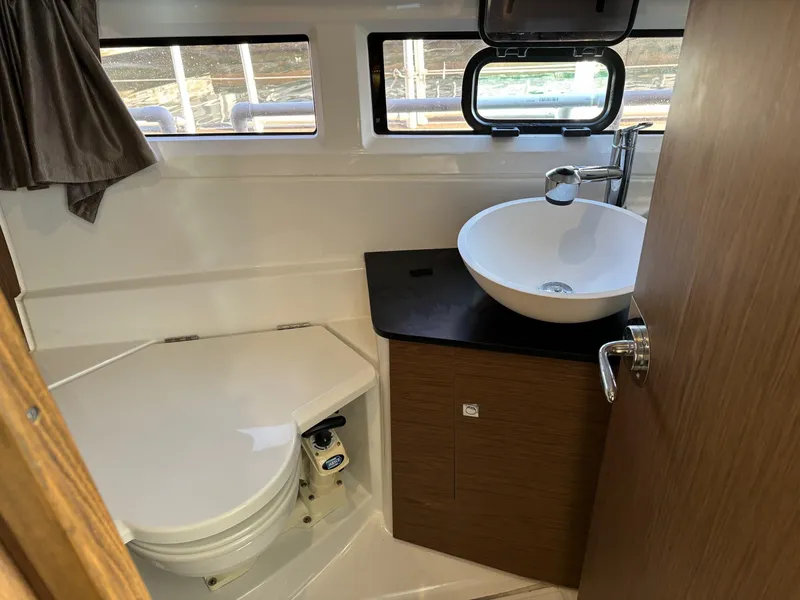 Slide: The Image of 2018 Jeanneau NC 895 boat bathroom with modern sink and toilet. - 16