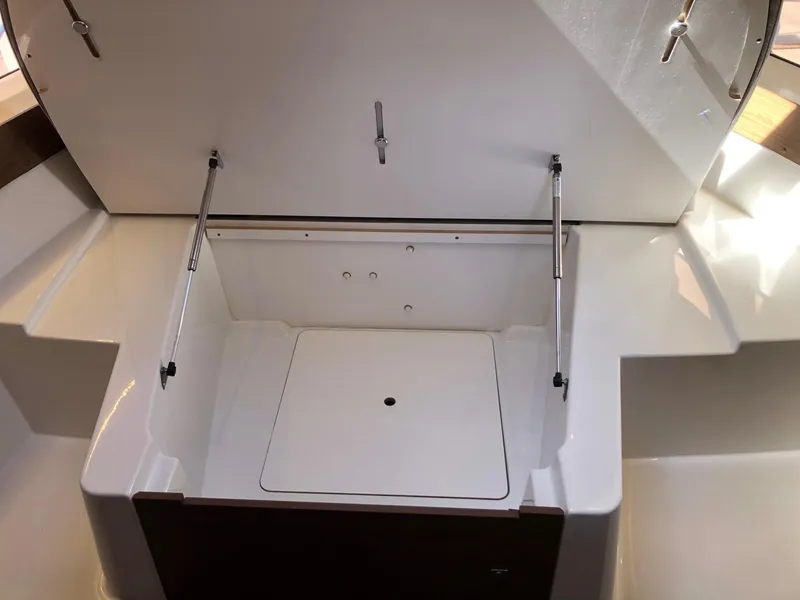 Slide: The Image of Open storage compartment on 2018 Jeanneau NC 895 boat. - 18